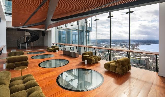 a lounge area with couches and chairs