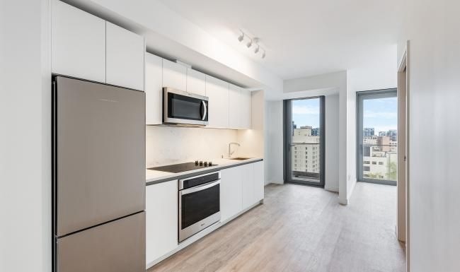 a kitchen with white cabinets