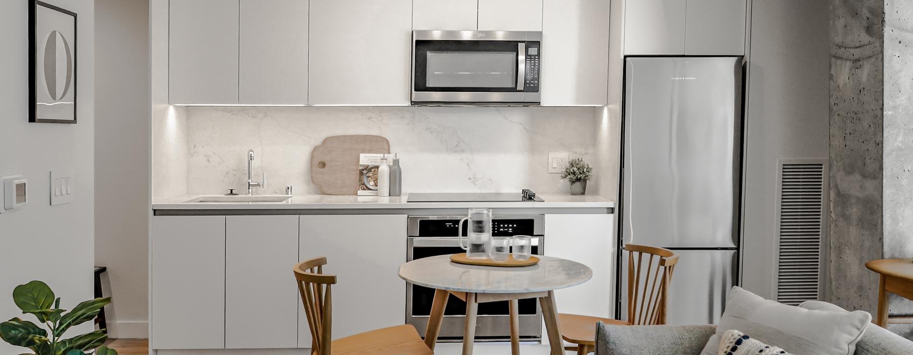 a kitchen with a table and chairs